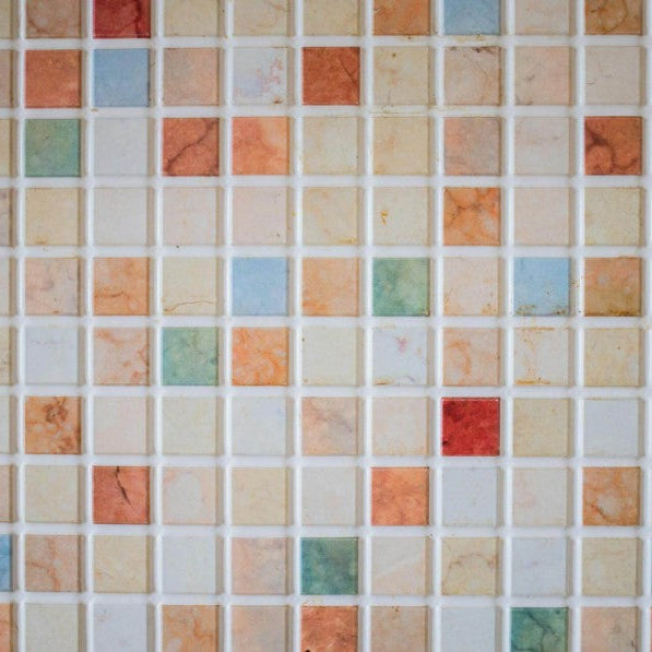 Clean white grout lines between tiles after deep cleaning and sealing