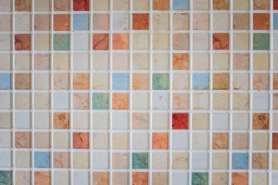 Clean white grout lines between tiles after deep cleaning and sealing