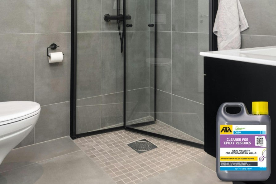 Cloudy epoxy grout haze being cleaned from porcelain tiles with Fila CR10