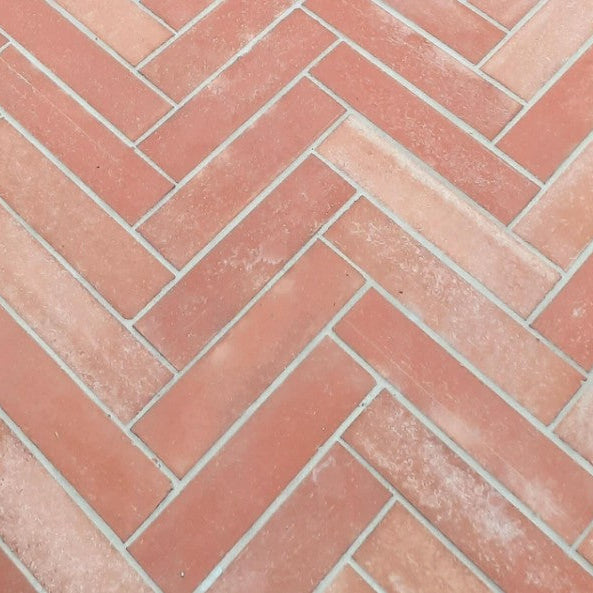 Sealed terracotta tile floor with a warm natural finish